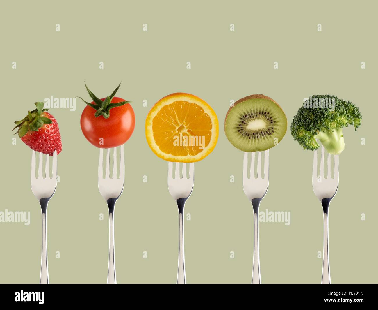 Fresh fruit and vegetables on forks. Stock Photo
