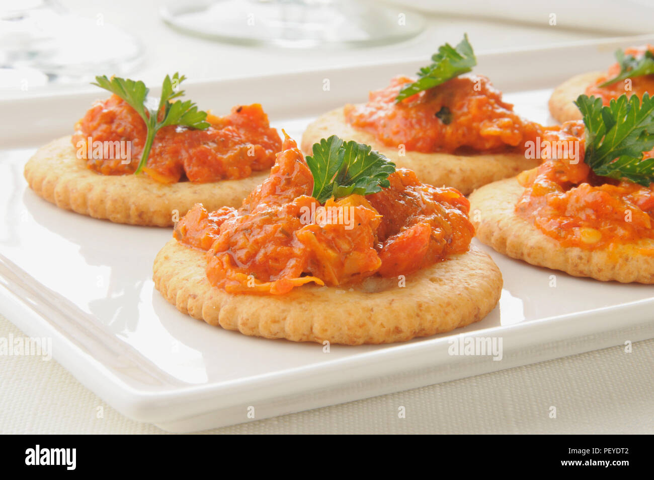 Whole wheat crackers with red bell pepper bruschetta Stock Photo Alamy