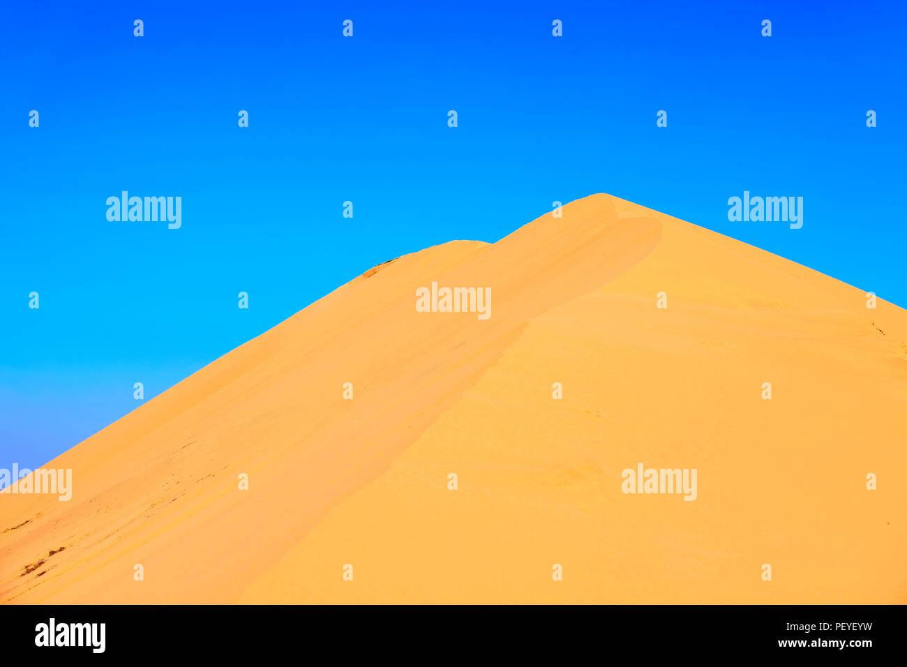 The desert under the blue sky Stock Photo - Alamy