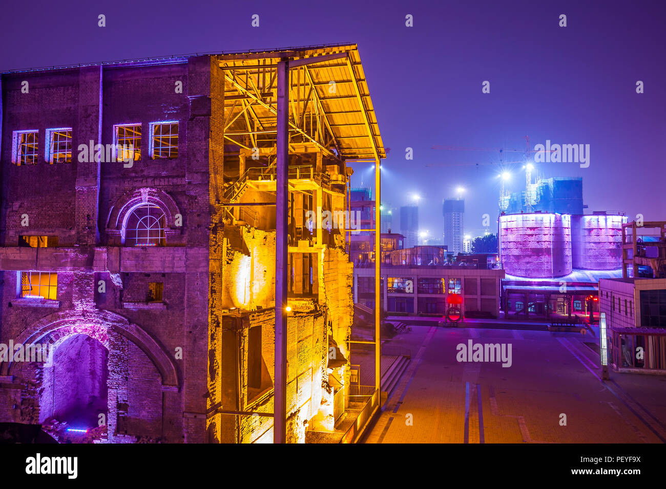 Factory buildings and industrial equipment in the evening Stock Photo