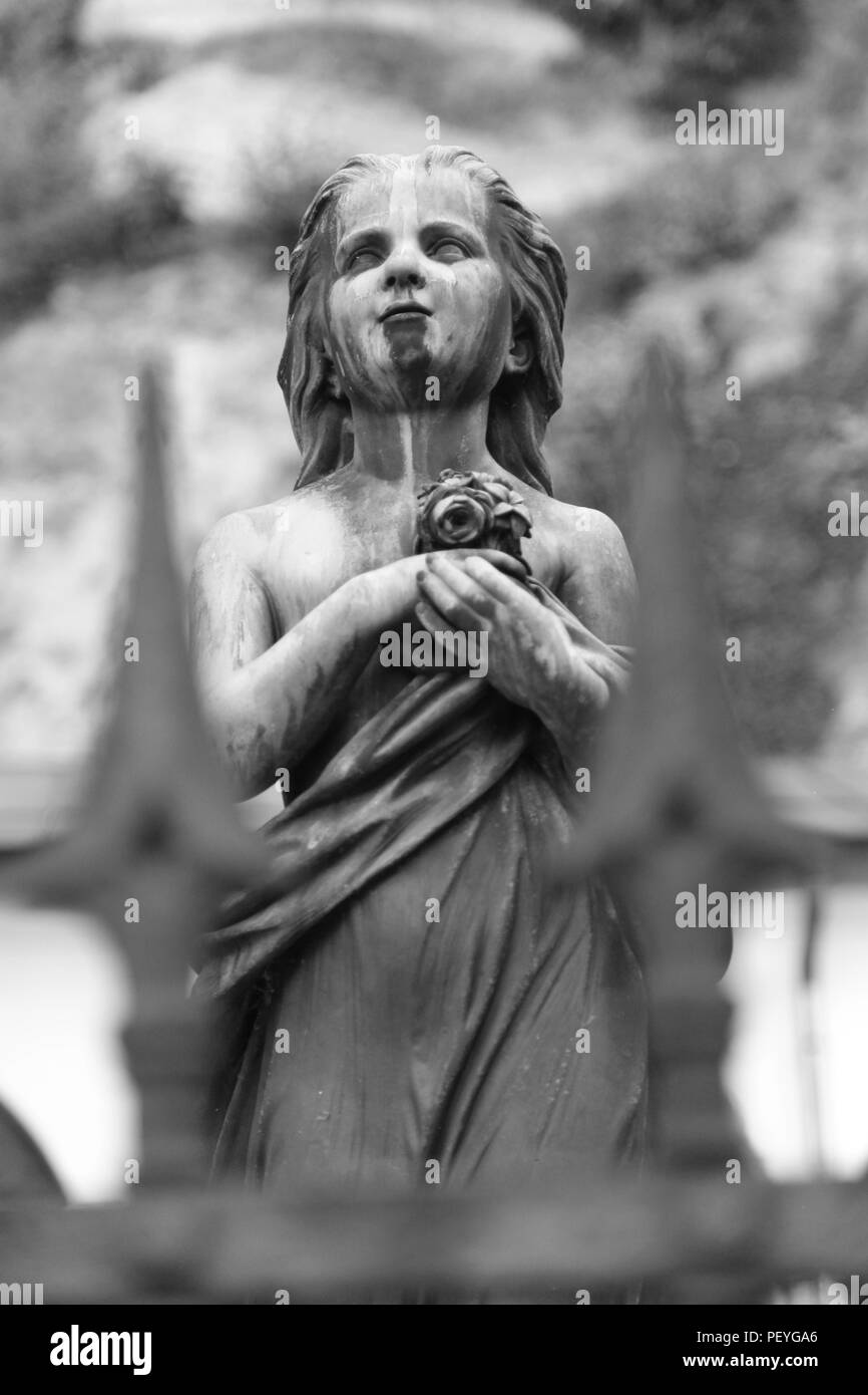 A grave statue in the cemetery of St Peters, Salzburg, Austria.. Stock Photo