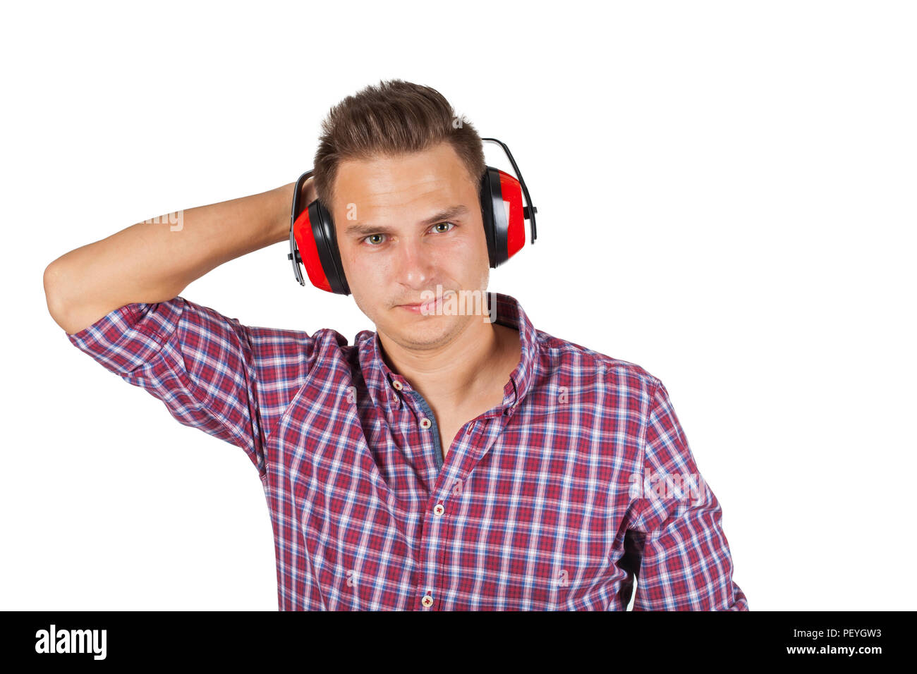 Young engineer on isolated background wearing noise cancelling headset