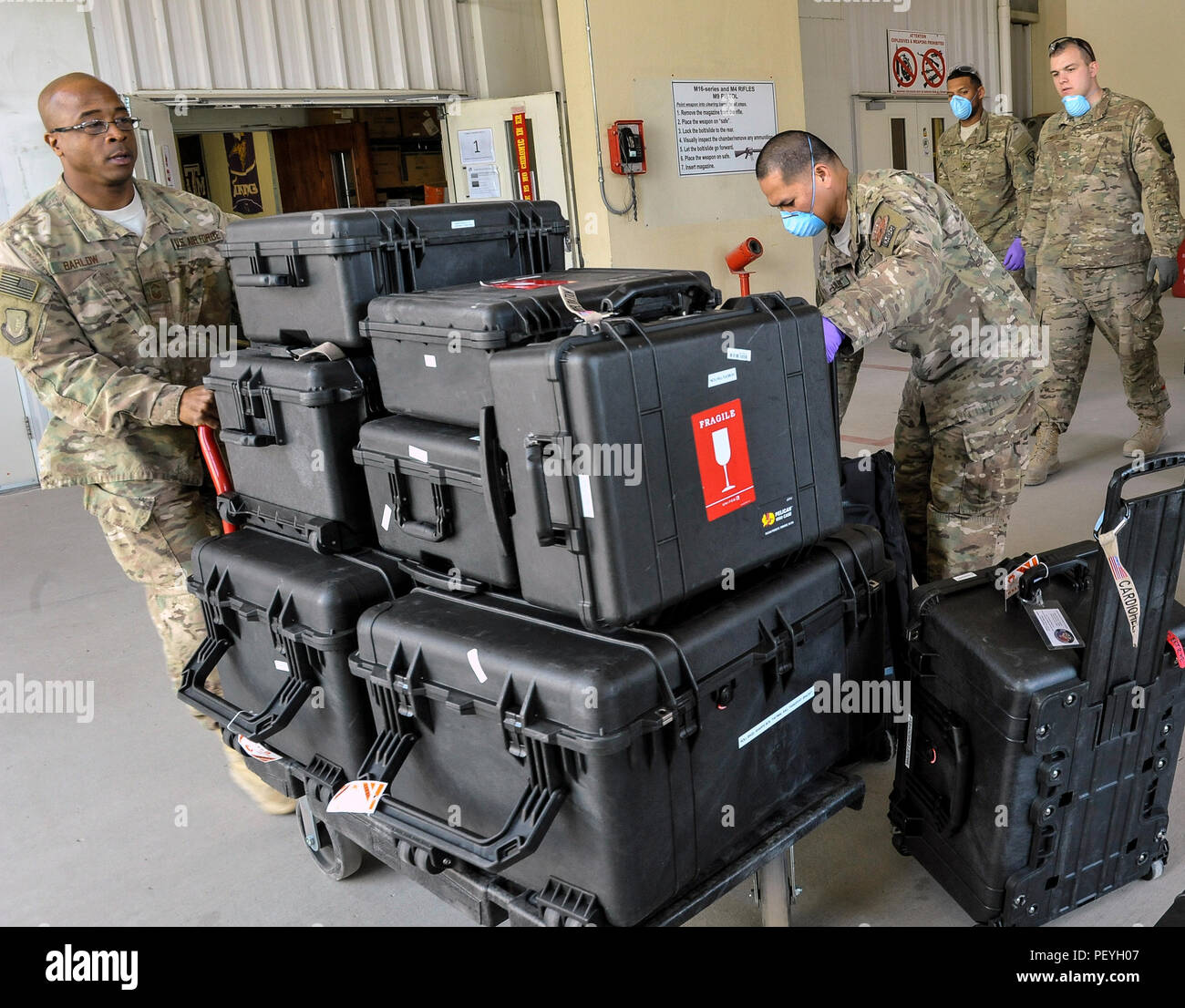 A 455th Expeditionary Medical Group team handles the Extracorporeal Membrane Oxygenation team’s equipment during a patient transfer at the Craig Joint-Theater Hospital at Bagram Air Field, Afghanistan, on Feb. 18, 2016. The ECMO team, dispatched from San Antonio Military Medical Center, uses technology that bypasses the lungs and infuses the blood directly with oxygen, while removing the harmful carbon dioxide from the blood stream. The patient was airlifted to Landstuhl Regional Medical Center, Germany, where he will receive 7 to 14 days of additional ECMO treatment. (U.S. Air Force photo by  Stock Photo