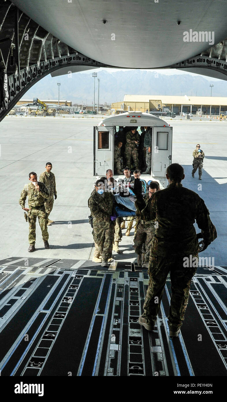 A 455th Expeditionary Medical Group team loads a NATO ally, who required Extracorporeal Membrane Oxygenation team support, onto an aeromedical evacuation transport at Bagram Air Field, Afghanistan, on Feb. 18, 2016. The ECMO team, dispatched from San Antonio Military Medical Center, uses technology that bypasses the lungs and infuses the blood directly with oxygen, while removing the harmful carbon dioxide from the blood stream. The patient was airlifted to Landstuhl Regional Medical Center, Germany, where he will receive 7 to 14 days of additional ECMO treatment. (U.S. Air Force photo by Tech Stock Photo
