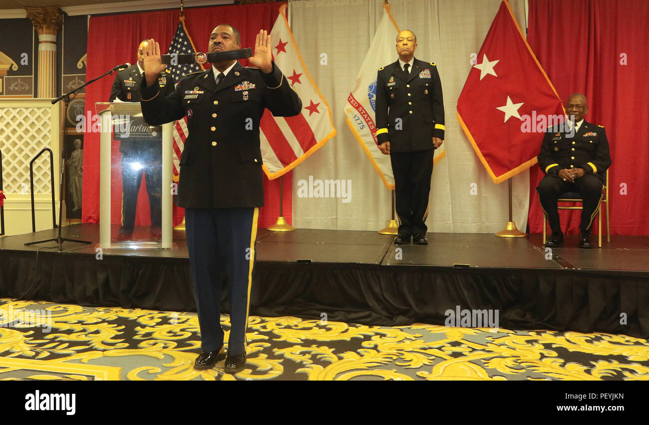 During a promotion ceremony in Upper Marlboro, Maryland, Master Sgt. Rodney  Spencer presented the general officer's belt to Brig. Gen. William J.  Walker, newly promoted District of Columbia National Guard land component