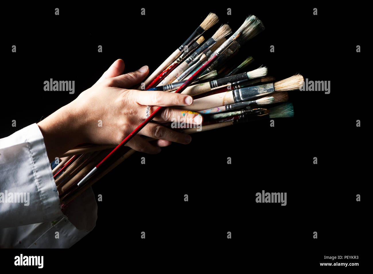 Woman holding brushes hi-res stock photography and images - Alamy