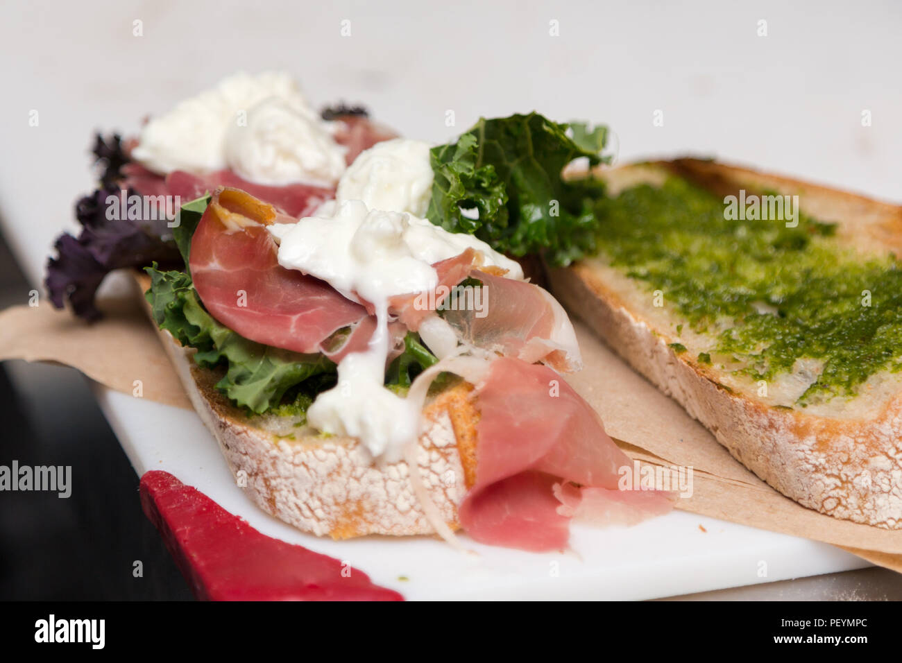 An Italian style sandwich with prosciutto and buffalo mozzarella Stock