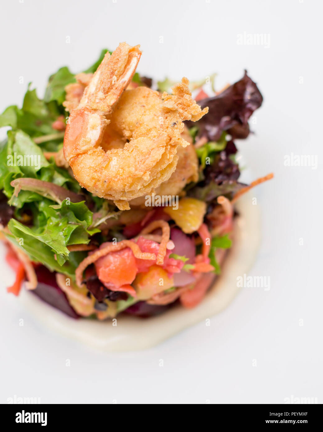 A prawn salad with beets on a white plate. Stock Photo
