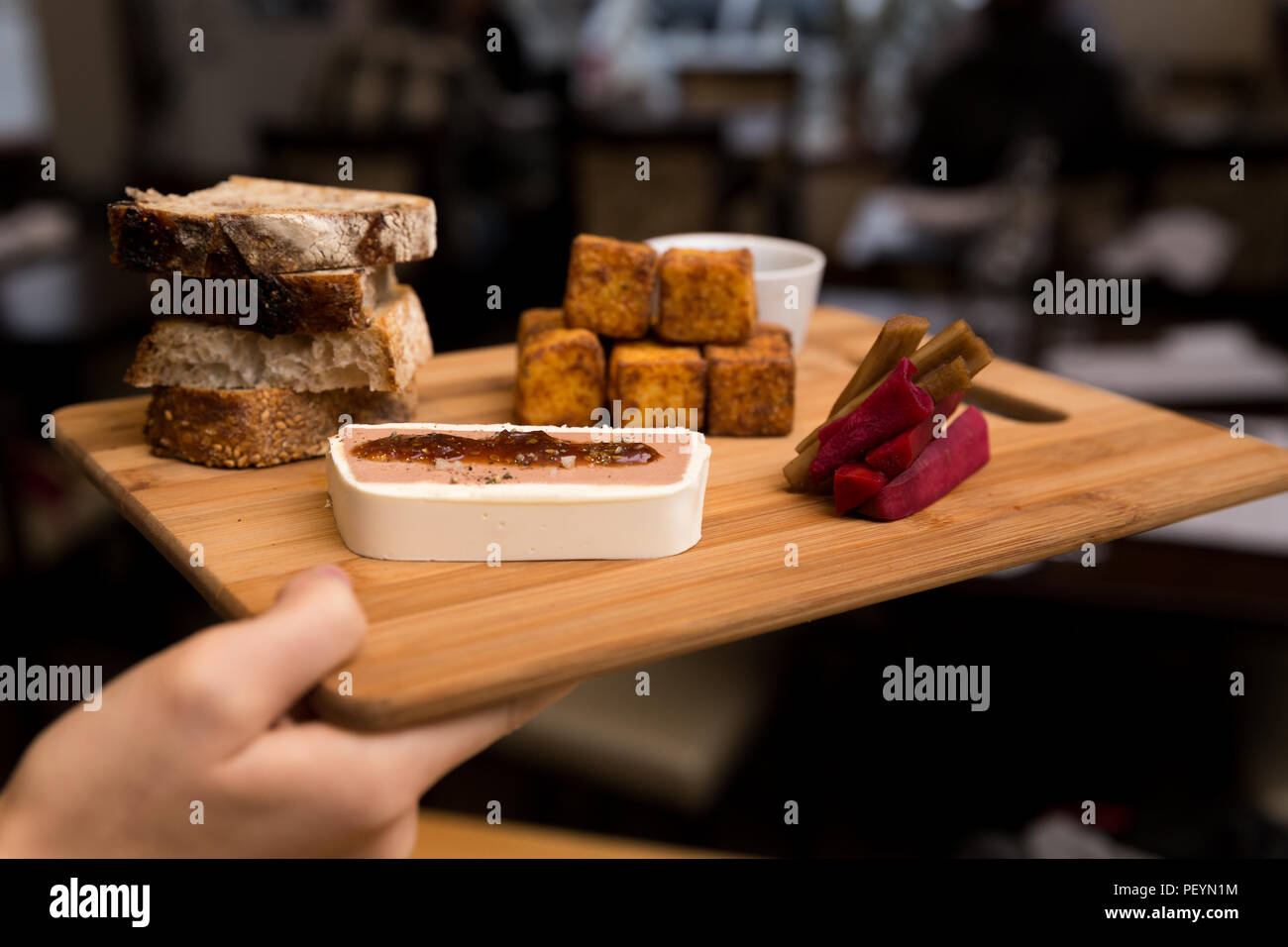 A European style appetizer platter consisting of chicken liver mousse