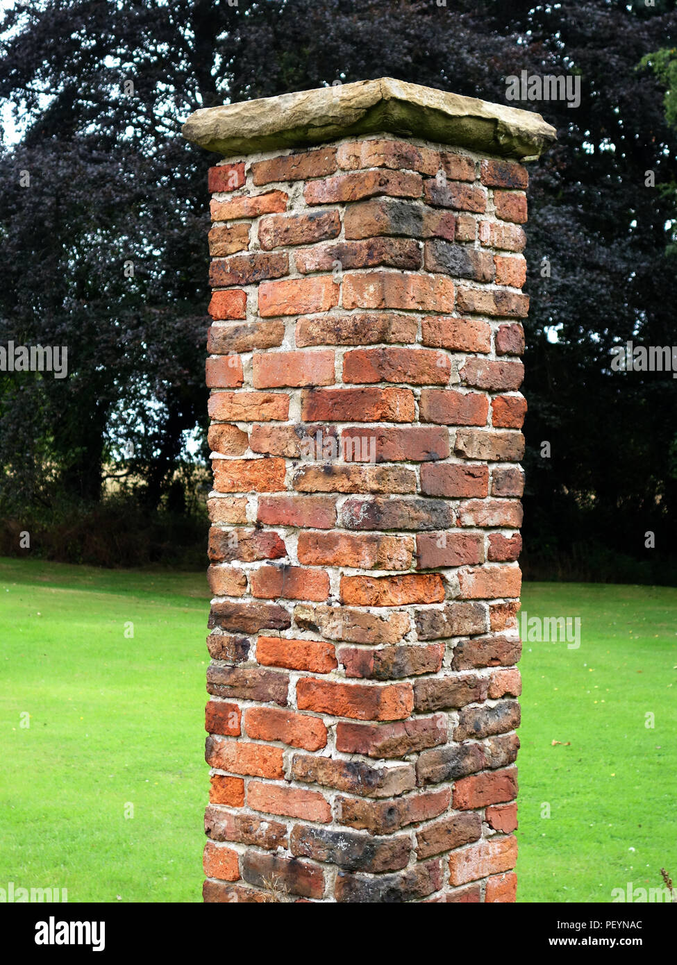 Closer up version of a victorian garden brick pillar of a pergola. These these garden brick pillars are now to be renovated Stock Photo