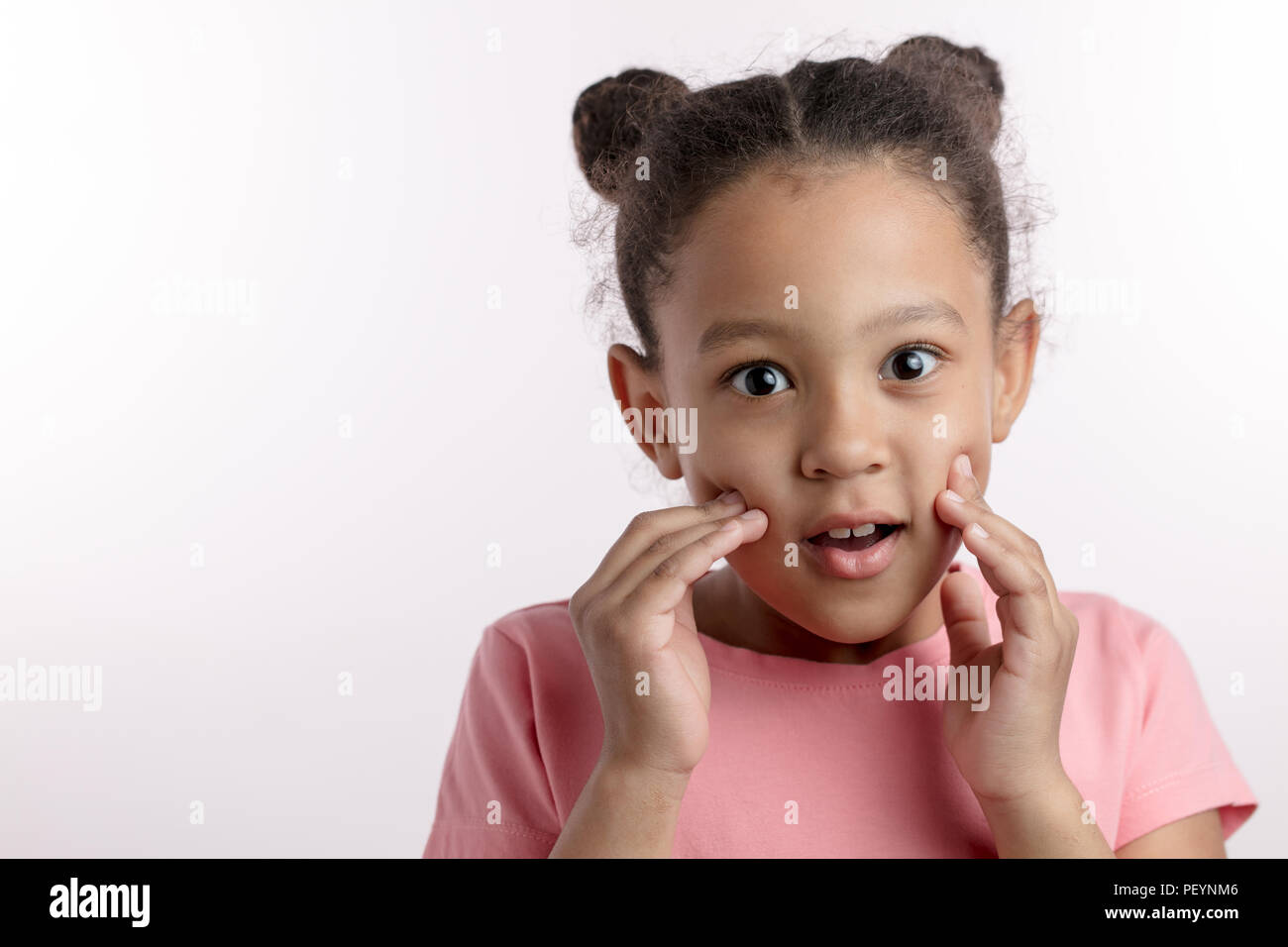 surprised little dark-haired girl with new hairstyle. amazemen concept. cheerful emotional mulatto kid with fingers on her cheeks. copy space. isolate Stock Photo - Alamy surprised little dark-haired girl with new hairstyle. amazemen concept. cheerful emotional mulatto kid with fingers on her cheeks. copy space. isolate Stock Photo - Alamy