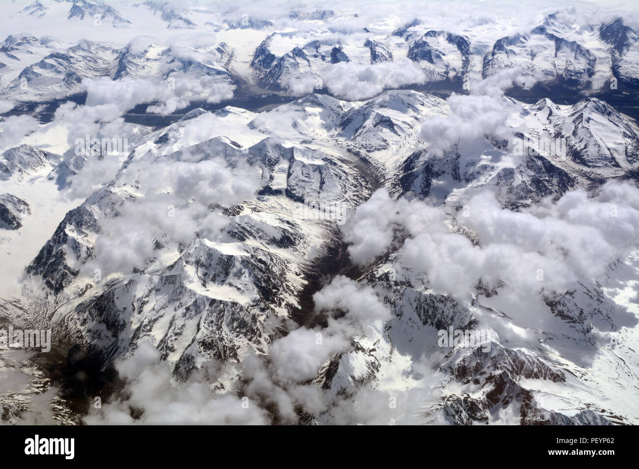 An aerial view of glaciated mountains and icefields in Wrangell St. Elias National Park and Preserve, Alaska, United States. Stock Photo
