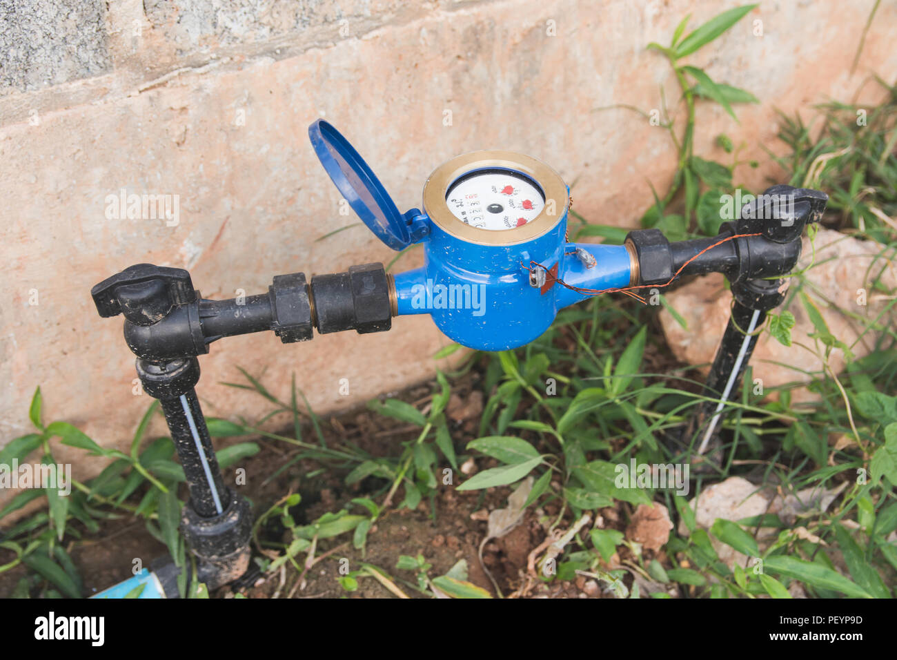 Water Meter blue with black water Pipe Stock Photo - Alamy