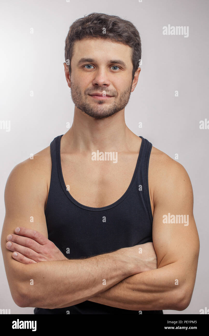 brutal strong sportsman with crossed arms. sport fan. sporty handsome
