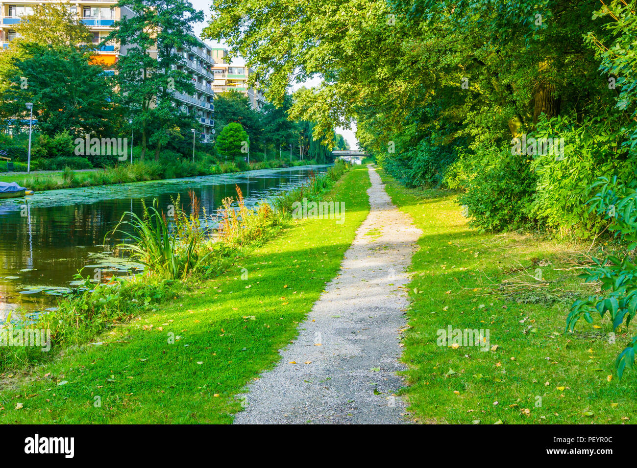 long walking path in beautiful water lake park landscape Stock Photo