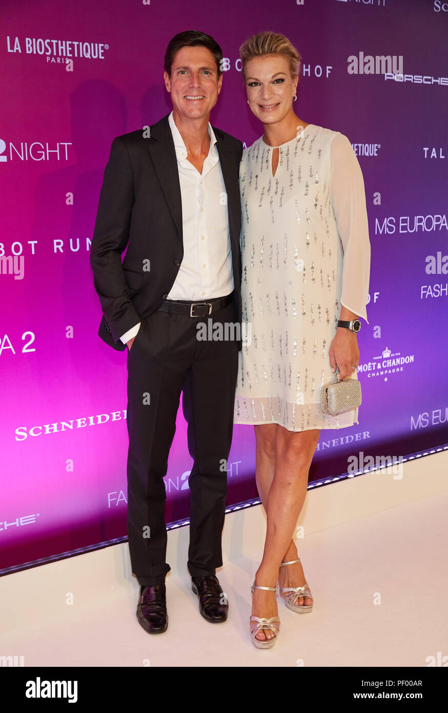 Hamburg, Germany. 17th Aug, 2018. Maria Hoefl-Riesch, former German ski racer, and her husband Marcus Höfl stand on the red carpet of the "Fashion2Night" on the MS Europa. Credit: Georg Wendt/dpa/Alamy Live News Stock Photo