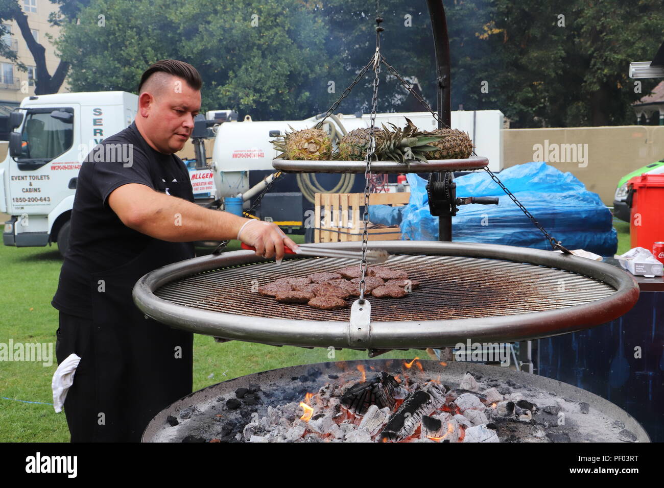 Dublin, Ireland. 18th Aug, 2018. A pitmaster prepares barbecued food at an  international BBQ festival in Dublin, Ireland, Aug. 17, 2018. An  international BBQ festival named The Big Grill opened here on