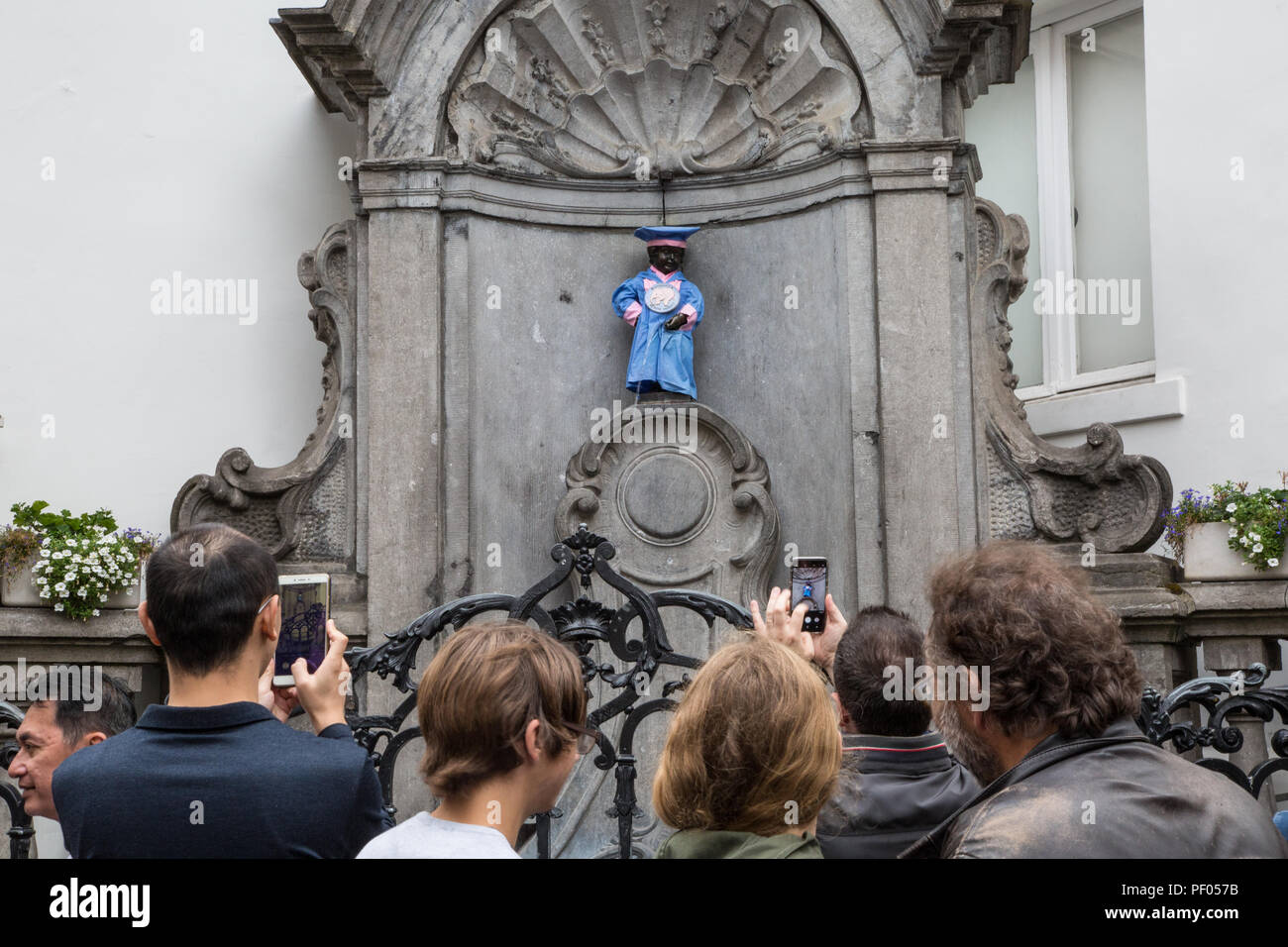 Brussels, Belgium. 18th August 2018 Manneken-Pis is the symbol of the Brussels folklore,during certain events he receives a special costume this costume is from the Pink Elephant Brotherhood a beer promotion company he will be dressed from 9am to 6pm 18th August 2018 Credit: steven roe/Alamy Live News Stock Photo