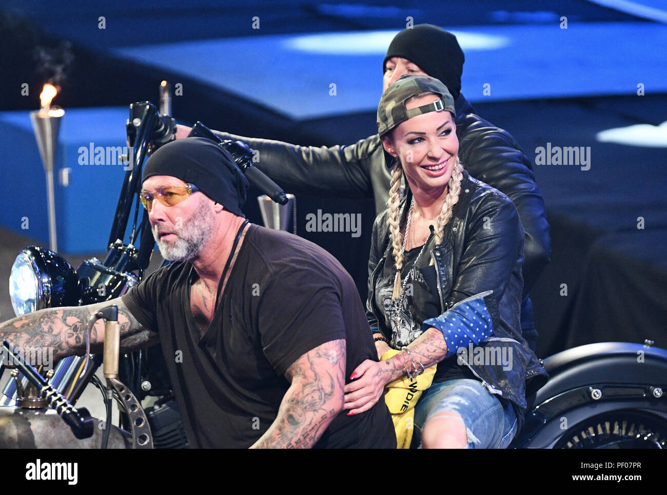 Cologne, Germany. 17th Aug, 2018. Cora Schumacher comes on stage with a motorcycle at the opening show of the new season of the Sat.1 reality show 'Promi Big Brother'. Credit: Henning Kaiser/dpa/Alamy Live News Stock Photo