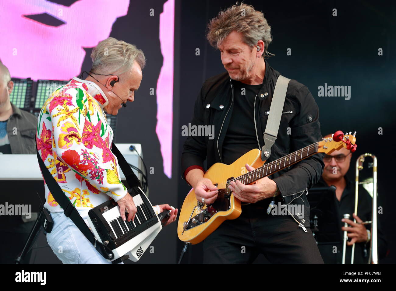 Henley-On-Thames, UK. 18th August 2018. Henley-On-Thames, UK. 18th August 2018.The Rewind Festival South in Henley-on-Thames on the first day attracted thousands of fans who dressed up for the occasion. On stage were singers and groups from the 80's. These included The Jam, former ELO members, Howard Jones, Billy Ocean, Odyssey,Jason Donovan, Nik Kershaw, Midge Ure, Marc Almond, Shalamar and Kool & the Gang. Credit: Uwe Deffner/Alamy Live News Credit: Uwe Deffner/Alamy Live News Credit: Uwe Deffner/Alamy Live News Stock Photo