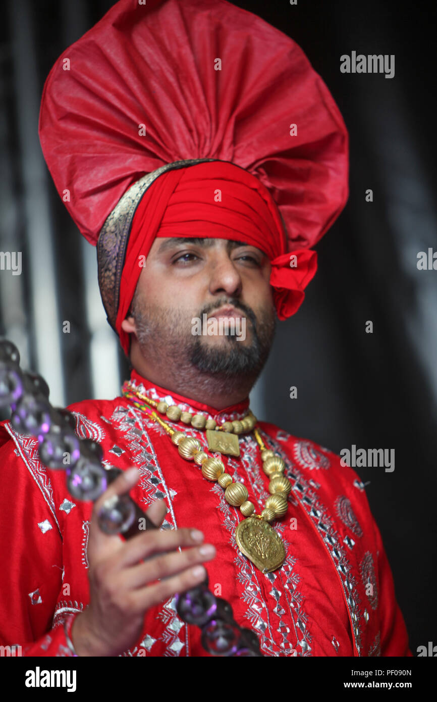 London, UK. 18th August 2018.  ZEE London Mela, a colorful kaleidoscope of music, dance and culture  took place for the very first time in Southall Park, the very heart of Europe’s oldest Asian community. This year marks the festival’s 16th gathering .Thousands come to enjoy the festival, outdoor arts, theater, film and dance and sample the fabulous food @Paul Quezada-Neiman/Alamy Live News Stock Photo