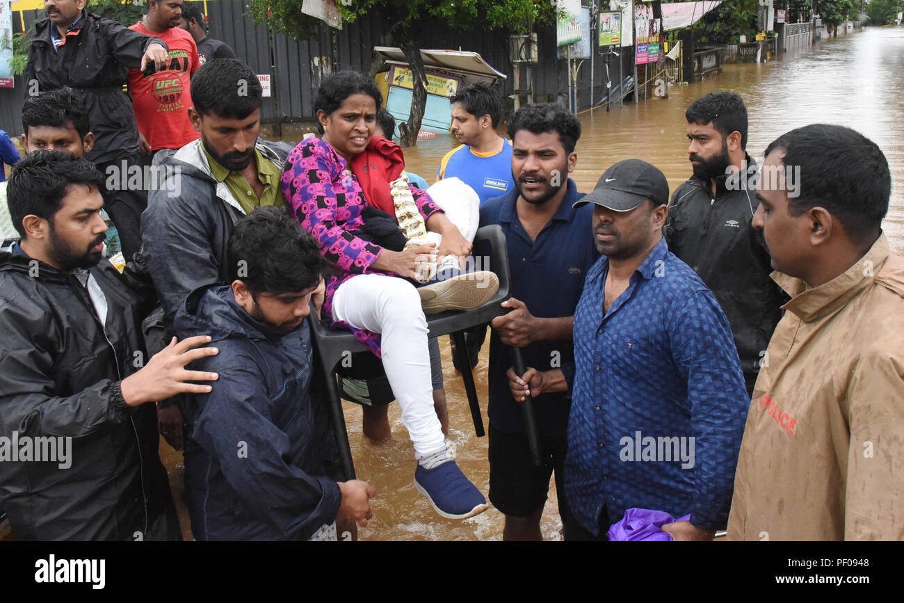 Kochi, India. 19th Aug, 2018. People evacuate from a flood-striken area in Kochi of Kerala State in India, on Aug. 18, 2018. Credit: Xinhua/Alamy Live News Stock Photo