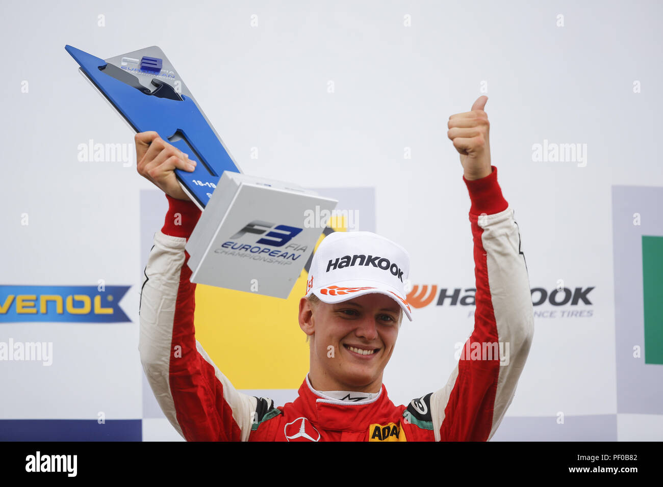 Towcester, UK. 18th Aug, 2018. MICK SCHUMACHER of Germany and Prema Theodore Racing is seen on the podium after winning the 2018 FIA Formula 3 European Championship race 2 at Silverstone Circuit in Towcester, United Kingdom. Credit: James Gasperotti/ZUMA Wire/Alamy Live News Stock Photo