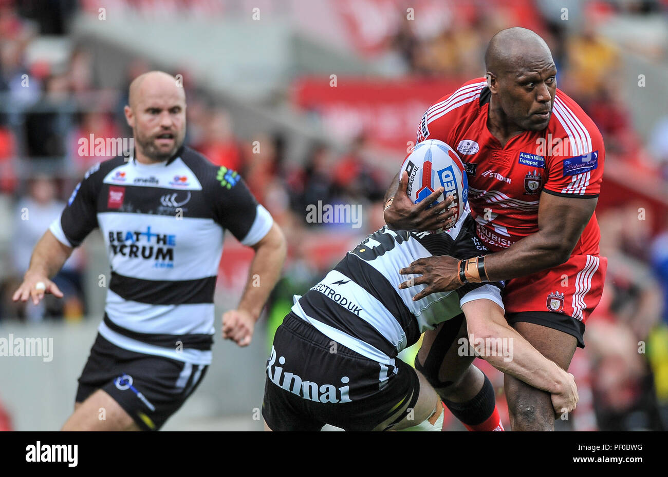 Salford, UK. 18/8/2018. Rugby League Super 8's Salford Red Devils vs Widnes Vikings ; Salford Red DevilsÕ Robert Luilooks to offload at the AJ Bell Stadium, Salford, UK.  Dean Williams Stock Photo