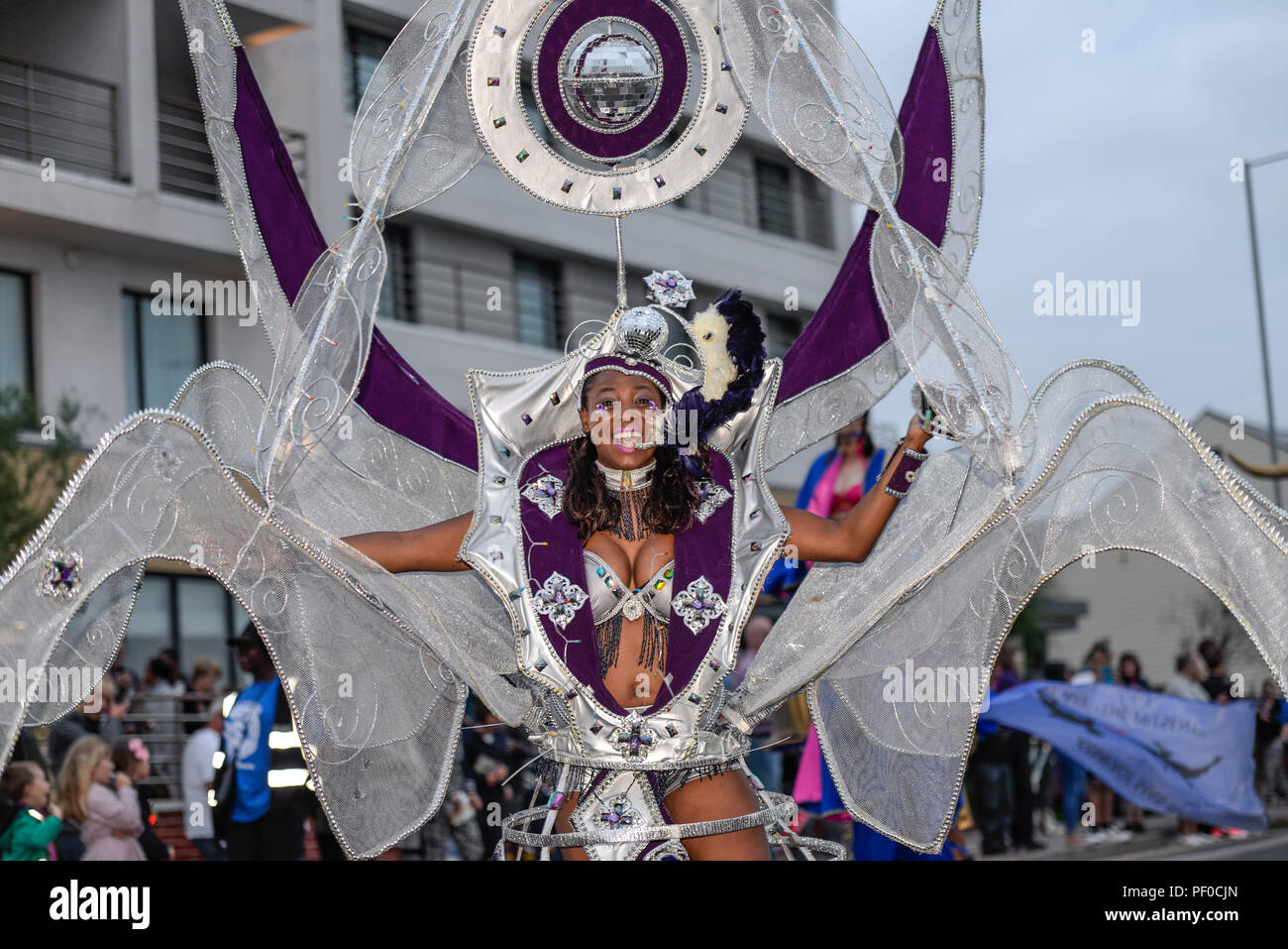 Southend SummerCare Carnival Procession. Southend on Sea, Essex, UK. Rampage Mas Band in the carnival parade. Female in Caribbean costume Stock Photo