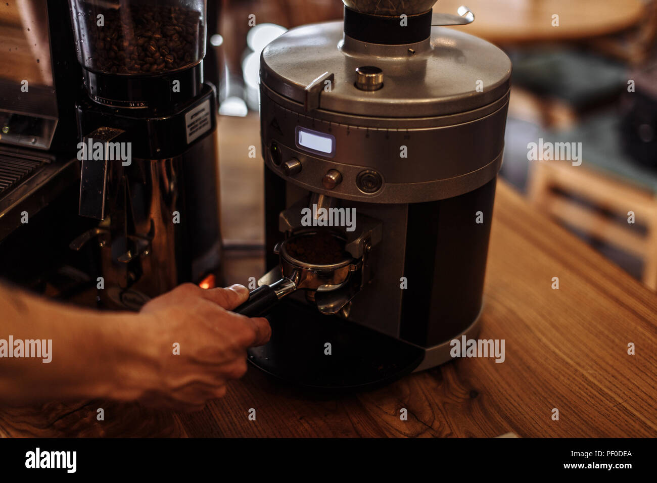 a man is going to brew fresh ground coffee. male holding coffee powder