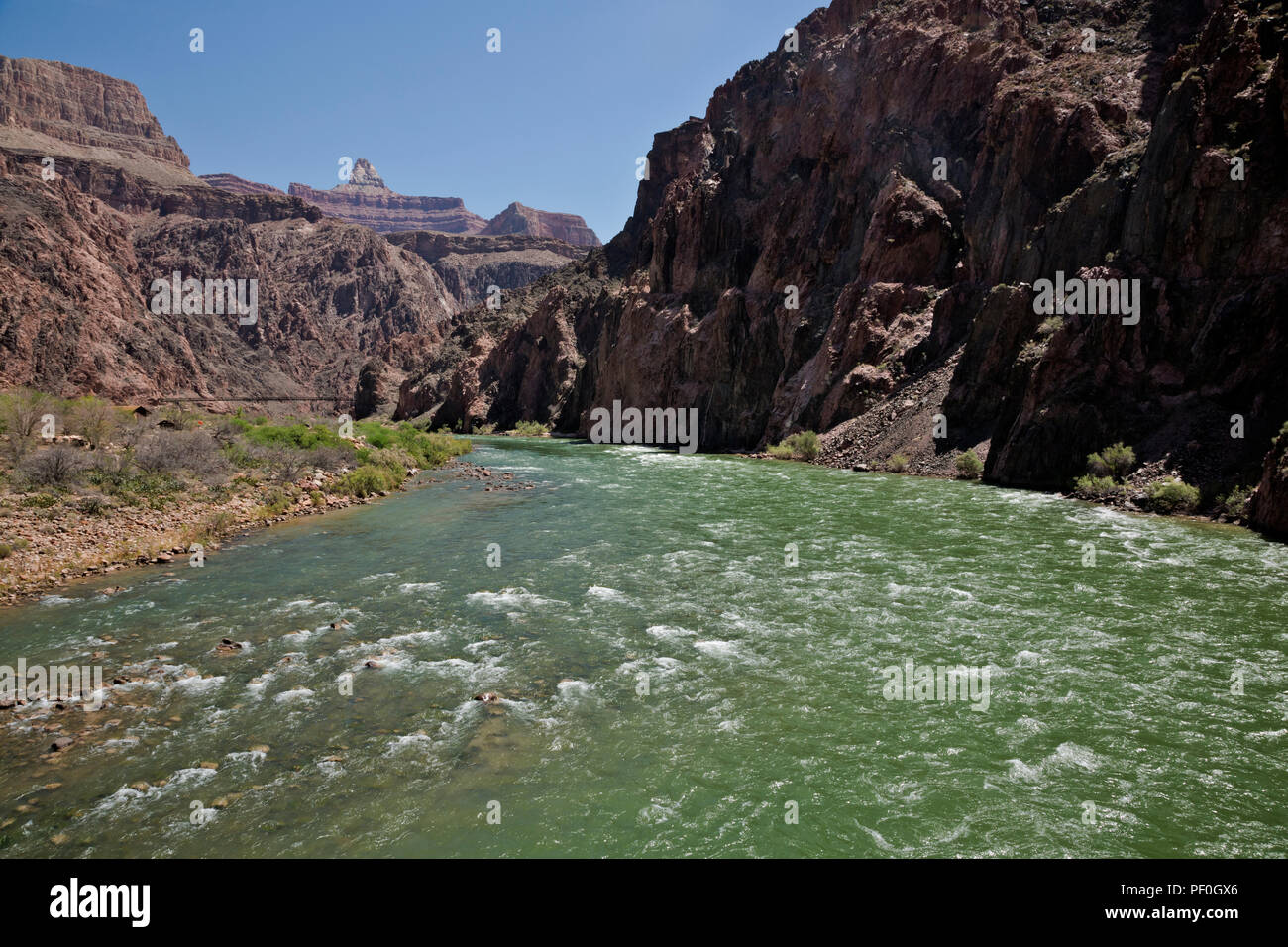 AZ00295-00...ARIZONA - The Colorado River and the Black Bridge from the Silver Bridge on the River Trail in Grand Canyon National Park. Stock Photo