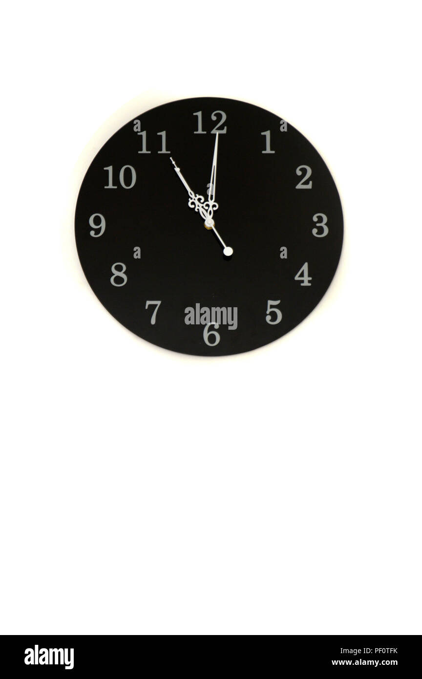 black clock on white wall Stock Photo Alamy