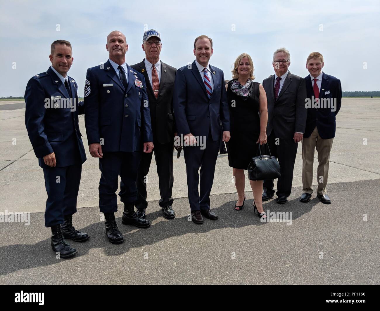 (Left to right) Col. Shawn Fitzgerald, 106th Rescue Wing vice commander, Chief Master Sgt. Michael Hewson, 106th Command Chief, John Raguso, Lee Zeldin, U.S. Congressman, Maria Z. Moore, Westhampton Beach Mayor,  Laurence Gibbs and Quentin Palifka, pose for a photo prior to the arrival of Air Force One at Francis S. Gabreski Airport, Westhampton Beach, N.Y., August 17, 2018. Francis S. Gabreski Airport is the home of the New York Air National Guard's 106th Rescue Wing. Stock Photo