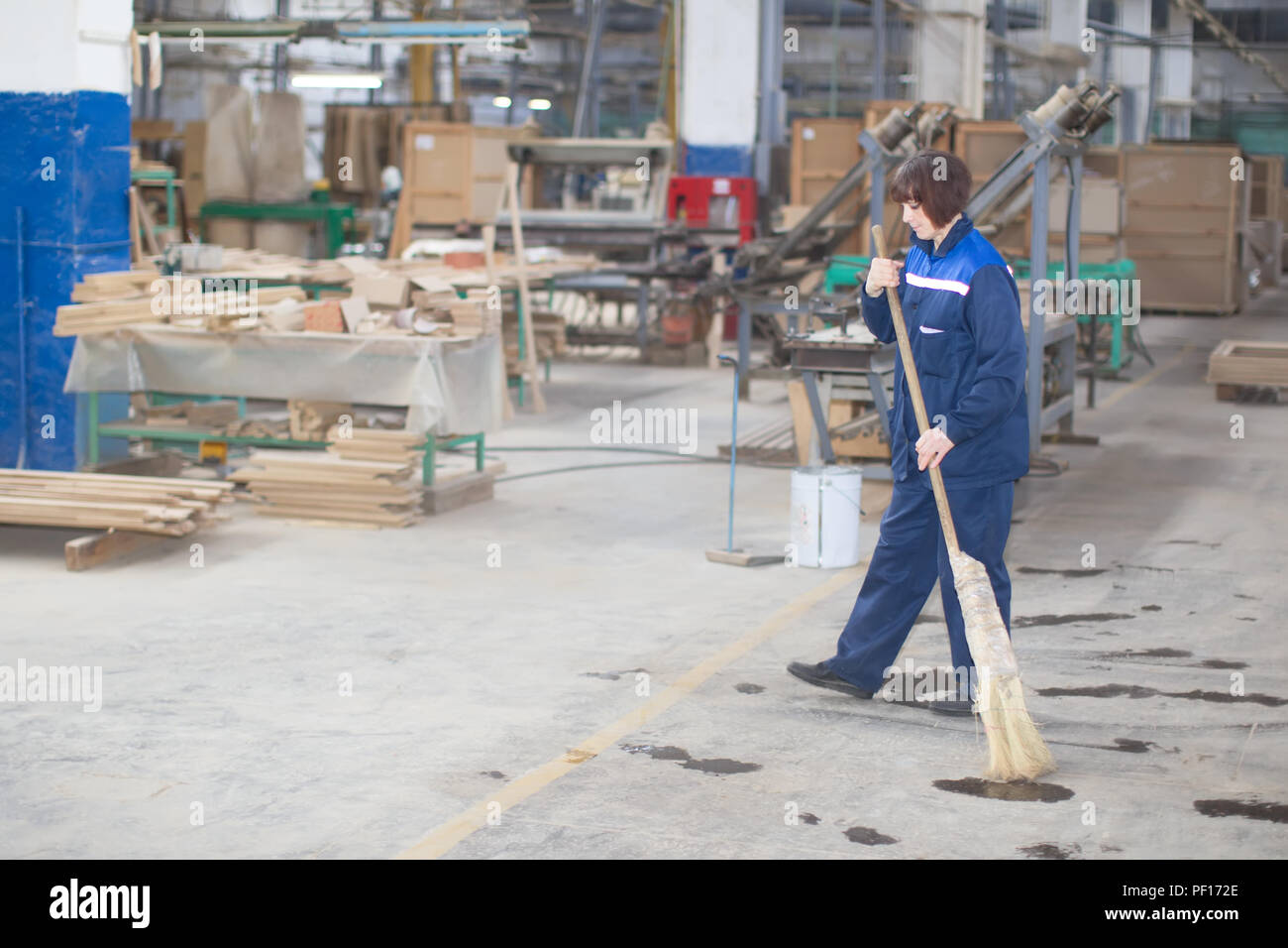 Belarus, the city of Gomel, on April 26, 2018. Furniture factory. Cleaning woman at the factory Stock Photo