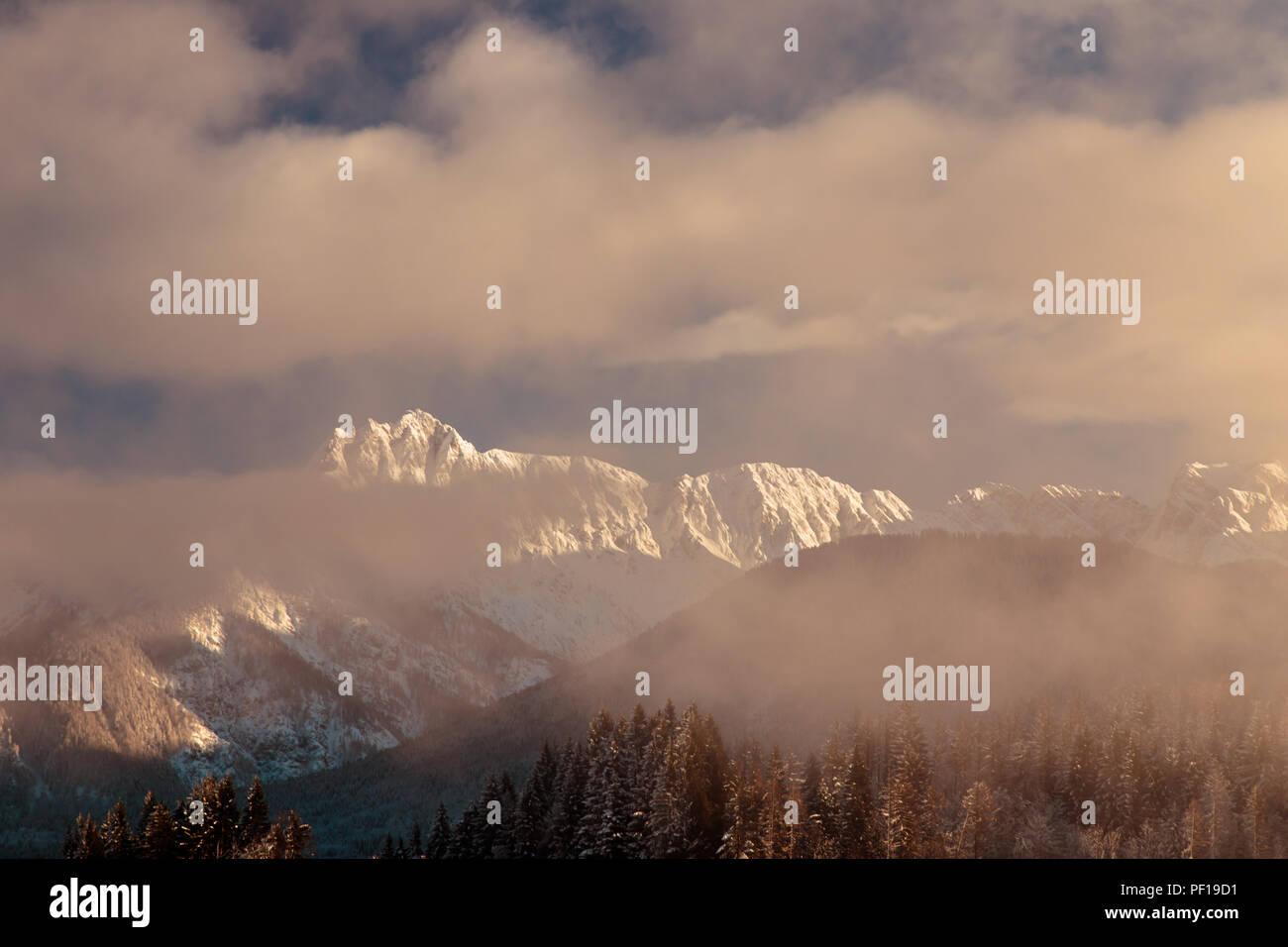 Clouds surrounding the italian alps after the snowfall Stock Photo - Alamy