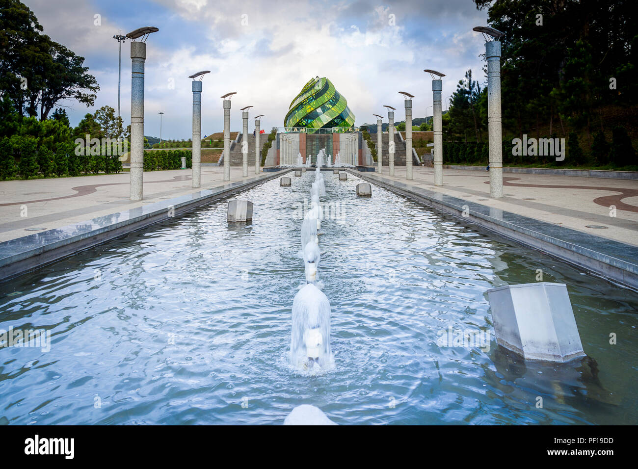 Fountains in front of green dome  at Lam Vien Square in Dalat, Vietnam. Stock Photo