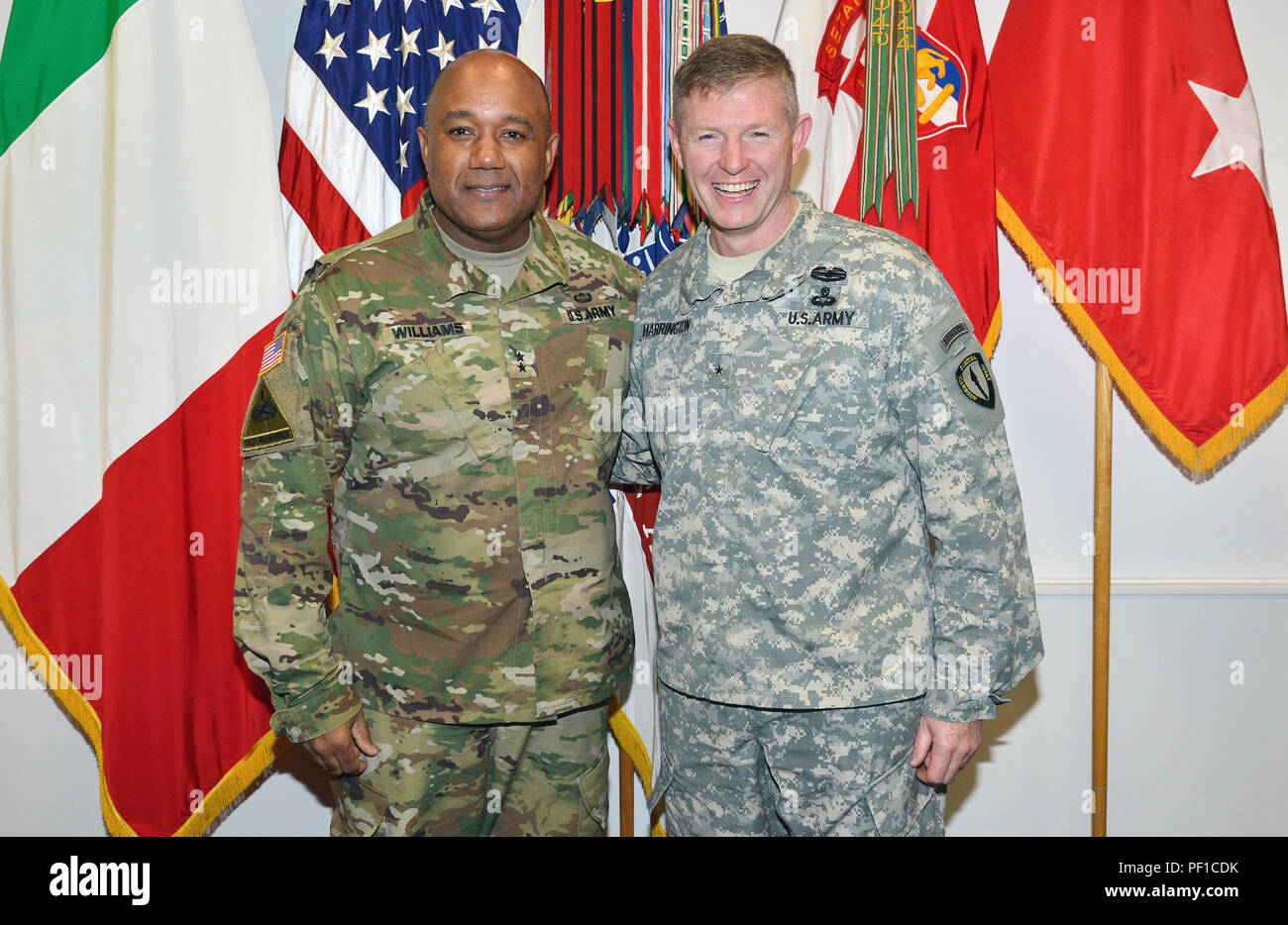 From left, Maj. Gen. Darryl A. Williams, U.S. Army Africa commanding  general, Brig. Gen. Joseph Harrington, U.S. Army Africa incoming commanding  general, pose for a group photo in the USARAF commander's office