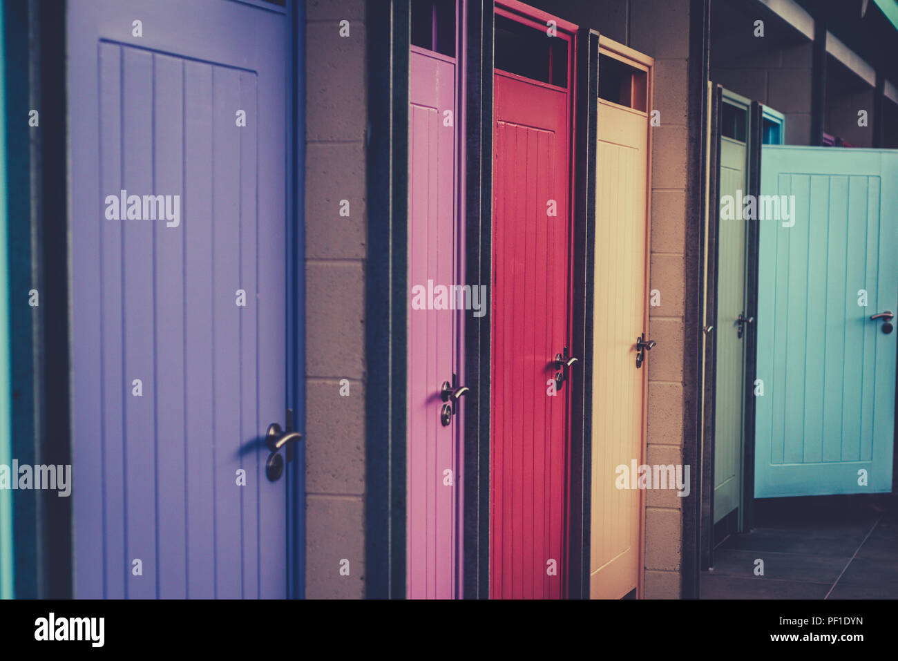 Colourful Doors on Changing Cubicles at a Swimming Pool and Gymnasium Stock Photo