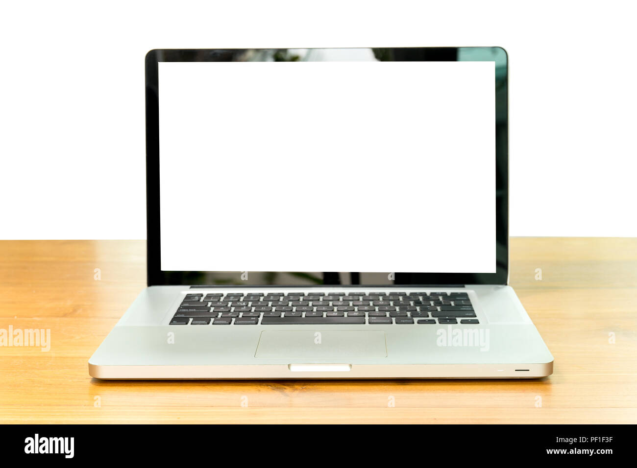 Laptop with blank screen on wooden table isolated Stock Photo - Alamy