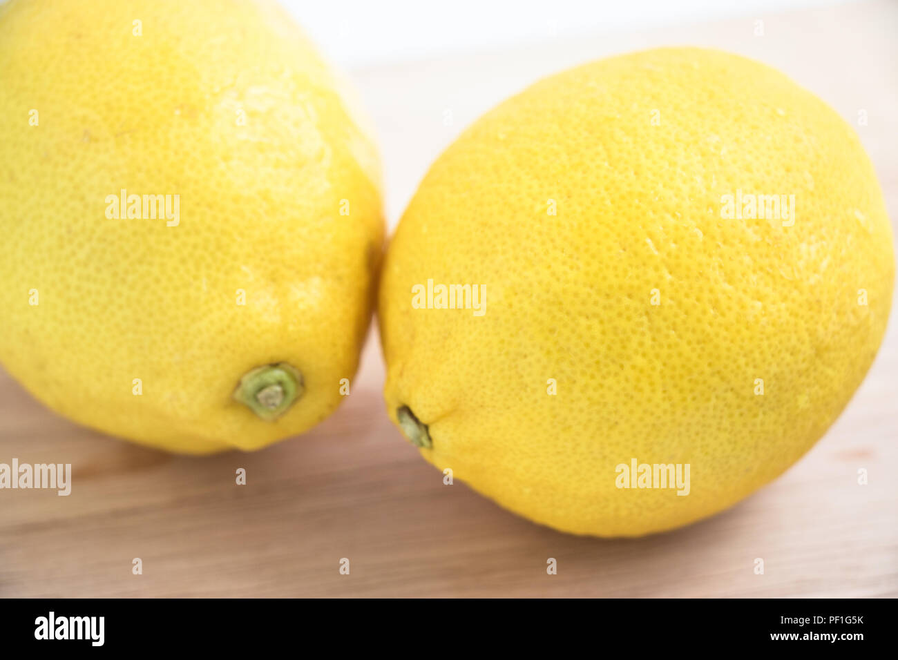 fresh lemon on the chopping block, isolate background Stock Photo