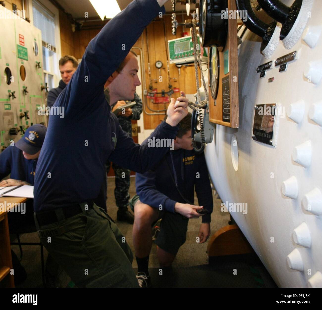 Navy divers assigned to Naval Undersea Warfare Center Keyport Dive