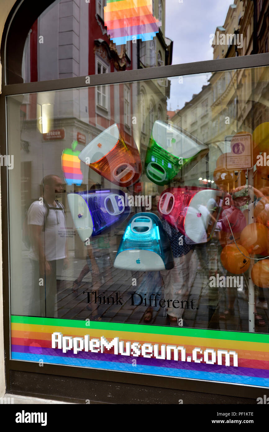Outside window in Apple computer museum devoted to Apple founder Steve Jobs in central Prague, Czech Republic with street reflection Stock Photo