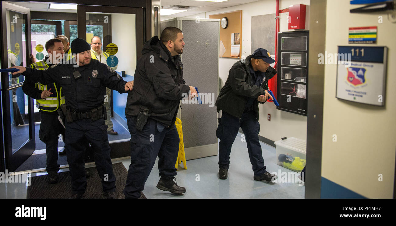 Joint Base Anacostia-Bolling security personnel clear the entrance of the  579 Medical Clinic on the base during the annual active threat training  conducted on Feb. 3, 2016. The training allowed the security