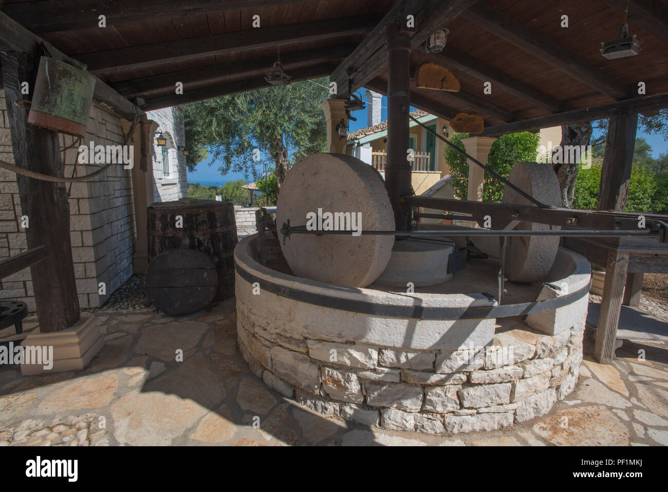 an old antique olive press at a farmhouse villa on corfu in kassiopi, greece. Stock Photo