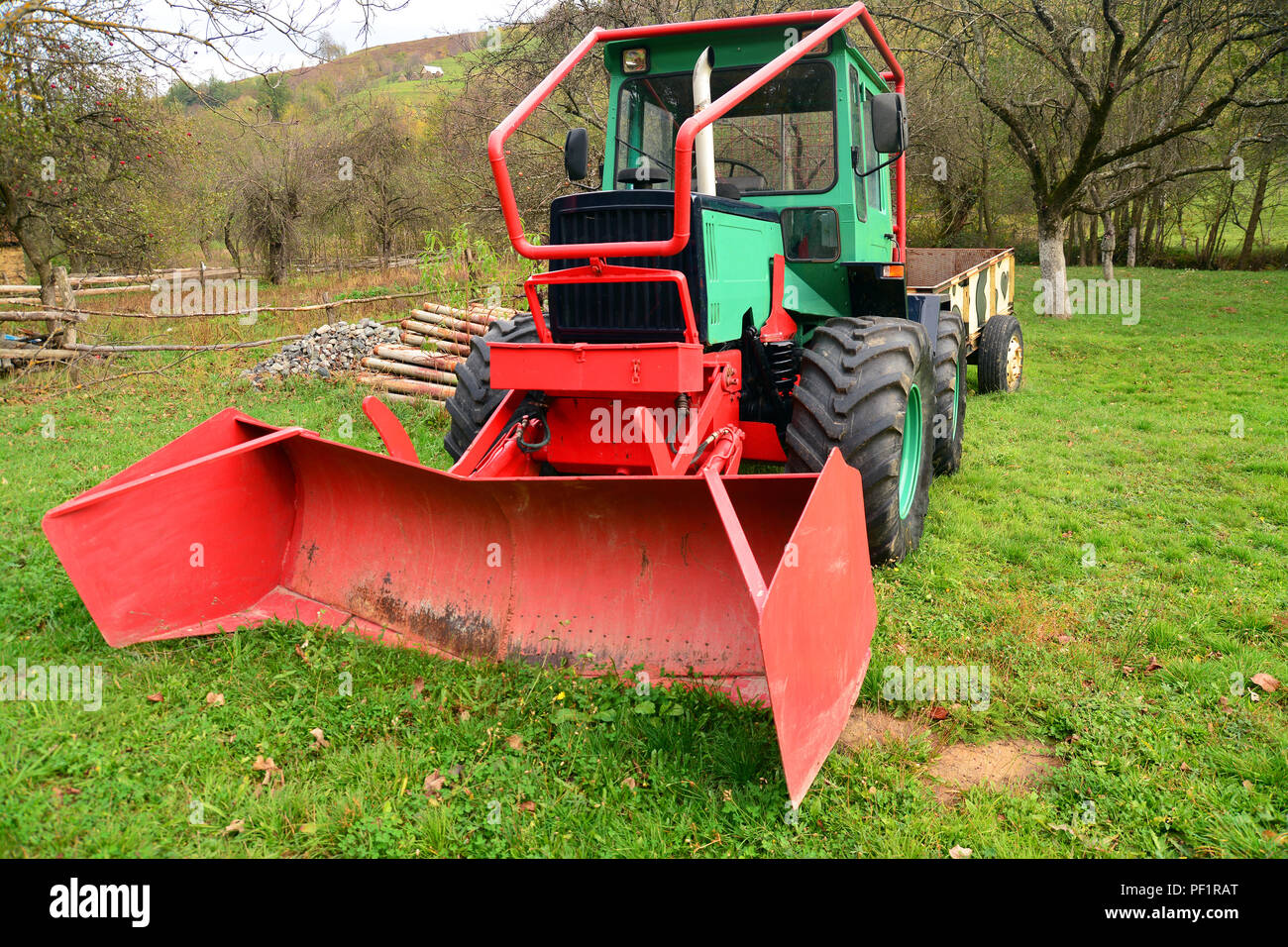 snow removing tractor in the grass Stock Photo