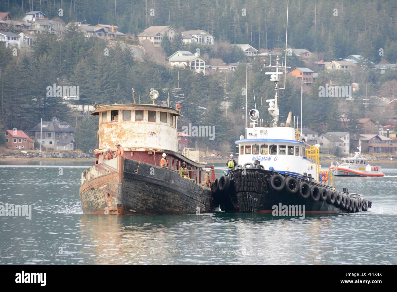Tug Norman O guides Tug Challenger to the mooring station at AJ Dock
