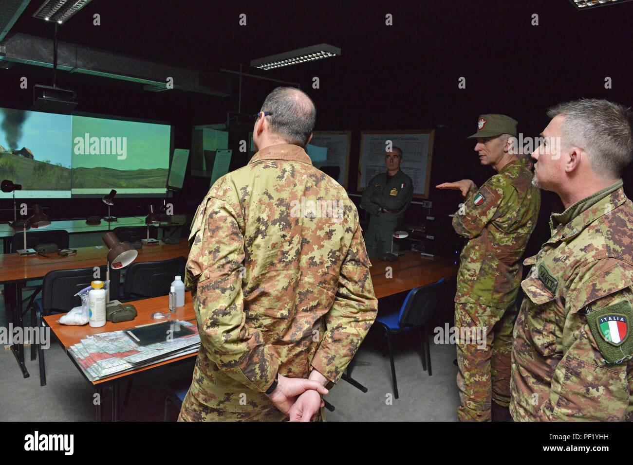 James V. Matheson, Chief, U.S. Army Regional Training Support Division, shows the Call For Fire Trainer system (CFFT) to Italian Army Brig. Gen. Michele Risi, Multinational Land Force “Julia” Alpine Brigade Commander and his brigade staff, during the tour at RTSD South in Caserma Ederle, Vicenza, Italy, February 24, 2016. Italian Army visit U.S. Army RTSD South, in order to enhance to bilateral relations and to expand levels of cooperation and the capacity of the personnel involved in joint operations. (Photo by Visual Information Specialist Paolo Bovo/Released) Stock Photo