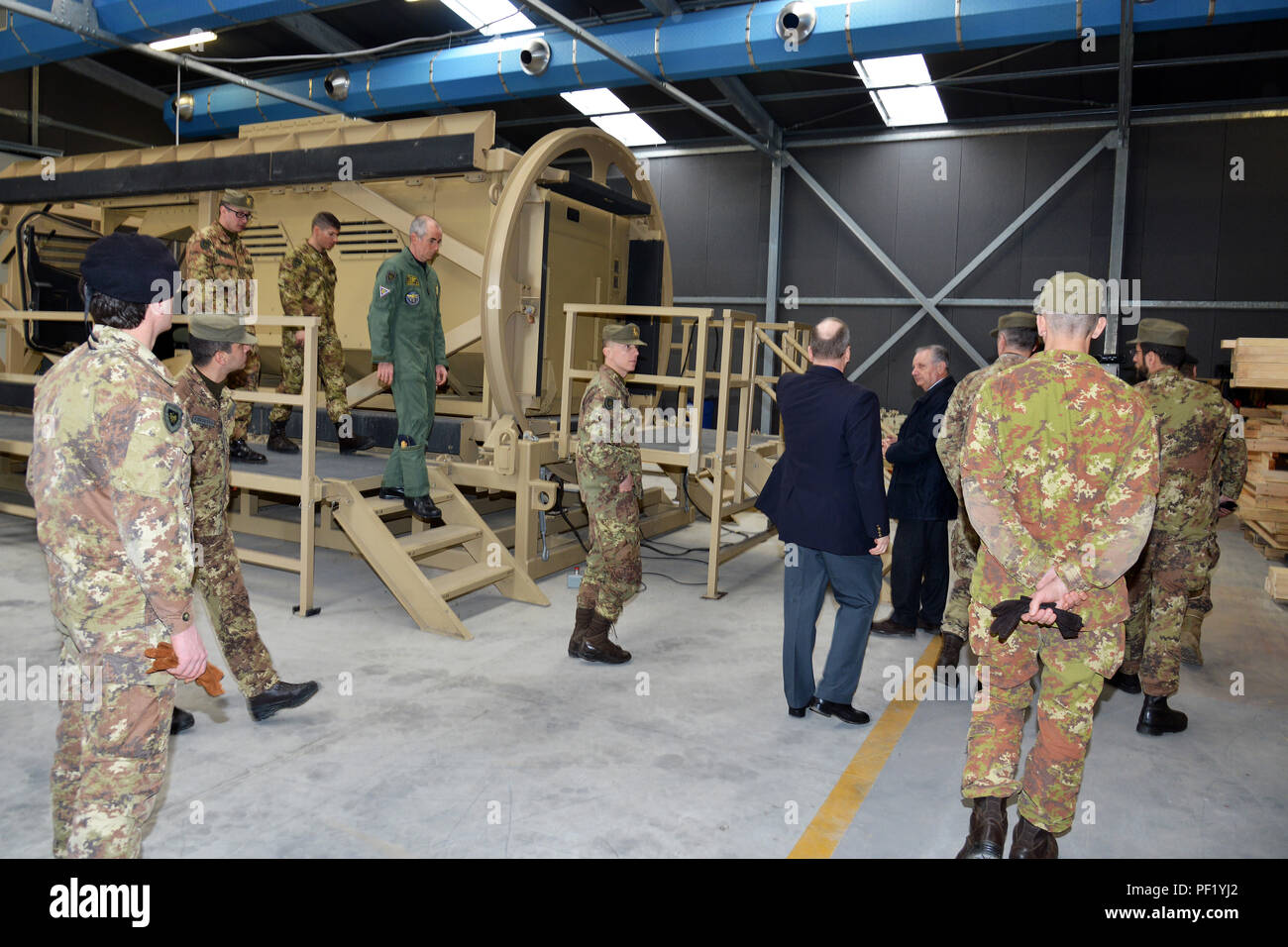 James V. Matheson, Chief, U.S. Army Regional Training Support Division, and Ivano Trevisanutto, Chief, U.S. Army Training Support Center Italy,  show  the Mine Resistant Ambush Protected (MRAP), to Italian Army Brig. Gen. Michele Risi, Multinational Land Force “Julia” Alpine Brigade Commander and his brigade staff, during the tour at RTSD South in Caserma Ederle, Vicenza, Italy, Feb. 24, 2016. Italian Army visit U.S. Army RTSD South, in order to enhance to bilateral relations and to expand levels of cooperation and the capacity of the personnel involved in joint operations. (Photo by Visual In Stock Photo