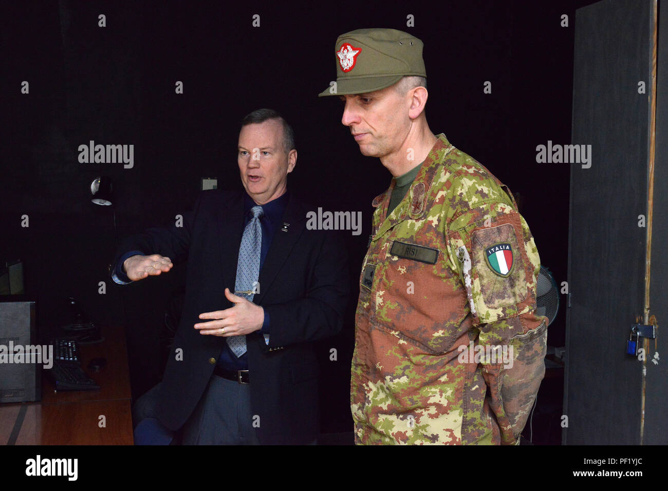 From left, James V. Matheson, Chief, U.S. Army Regional Training Support Division, shows  the Call For Fire Trainer system (CFFT) to Italian Army Brig. Gen. Michele Risi, Multinational Land Force “Julia” Alpine Brigade Commander, during the tour at RTSD South in Caserma Ederle, Vicenza, Italy, February 24, 2016. Italian Army visit U.S. Army RTSD South, in order to enhance to bilateral relations and to expand levels of cooperation and the capacity of the personnel involved in joint operations. (Photo by Visual Information Specialist Paolo Bovo/Released) Stock Photo