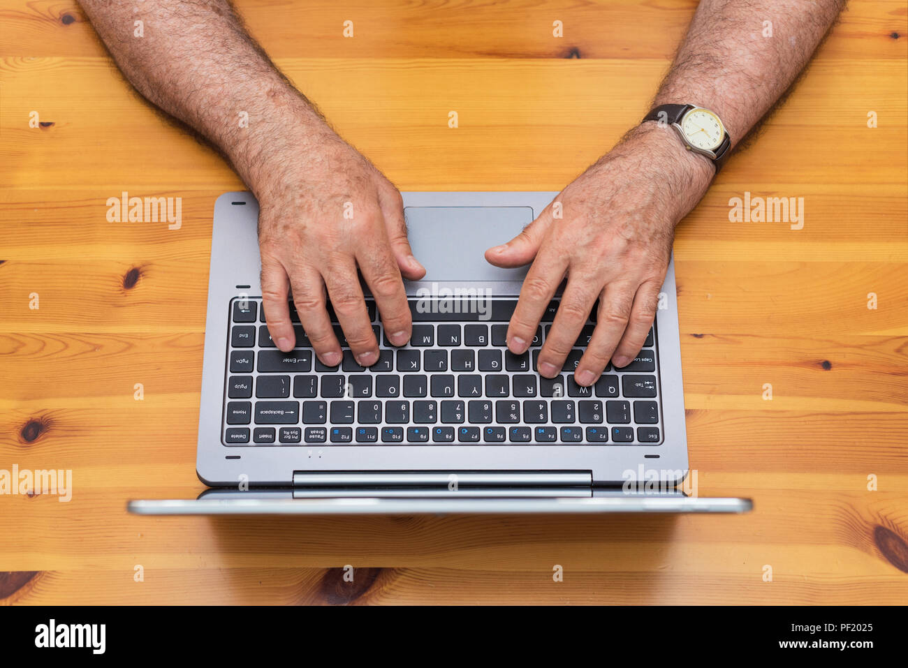 Senior man working with laptop. top view. Stock Photo
